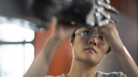 Woman working with AutoCAD and robotics at Autodesk's Pier 9 in San Francisco, CA.