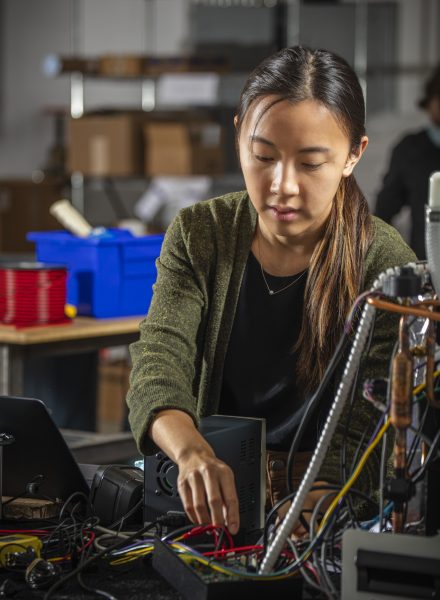 A woman working on circuit boards