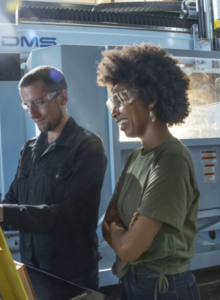 People working at a CNC Machine Shop