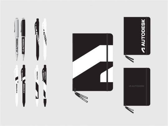 Examples of pens and books with Autodesk branding