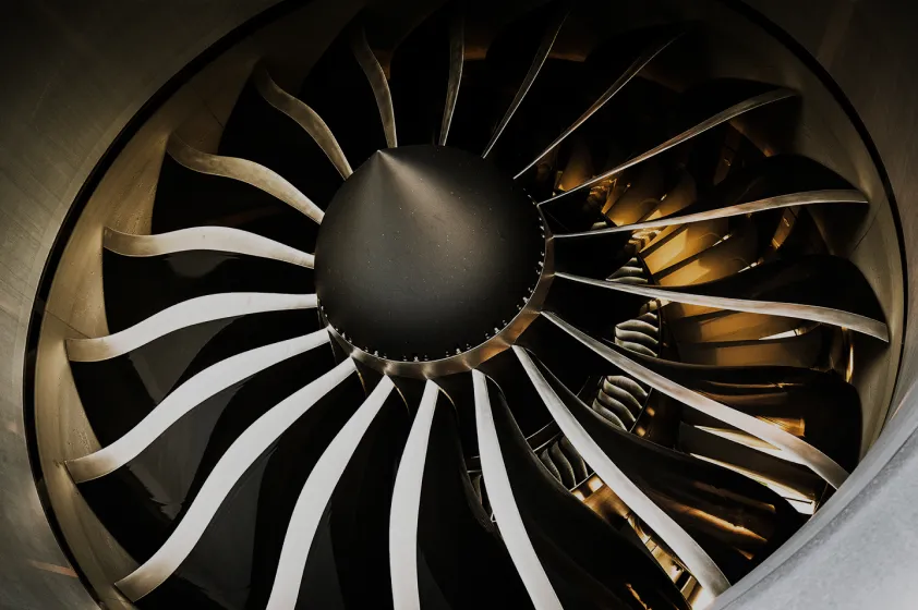 Close-up abstract photo of a large, industrial looking turbine