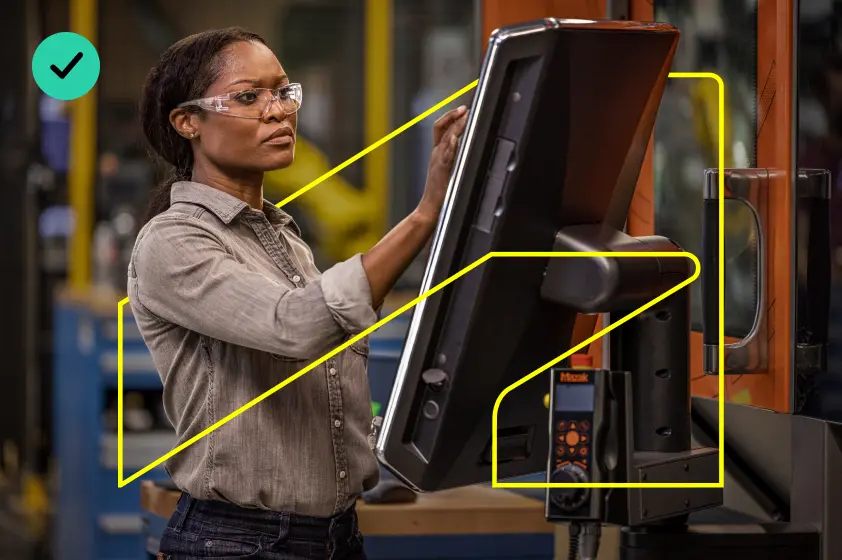 Example of correct usage of The Thread, showing a person operating a piece of machinery. The person and the machinery overlap with the symbol in an elegant way that creates a sense of depth