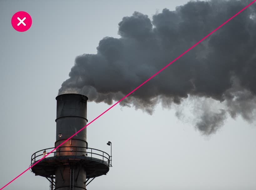 Dark smoke pours out of a smokestack, implying a negative environmental impact. Marked with a red X.